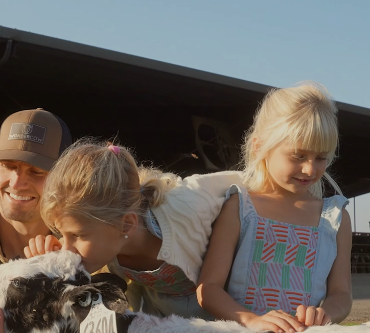 Rob, 7th-generation dairy farmer, with his family on the WonderCow farm